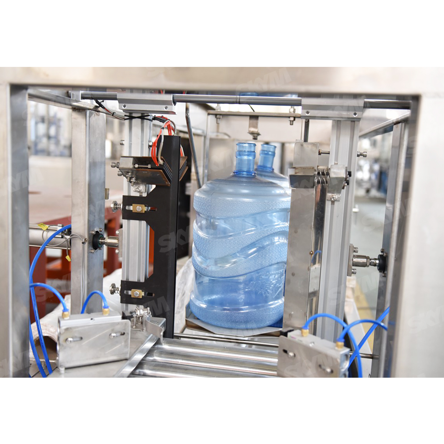 Grande bouteille industrielle de remplissage d'eau de 5 gallons et machine de capsulage